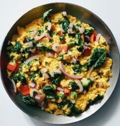 scrambled eggs with spinach tomatoes onion